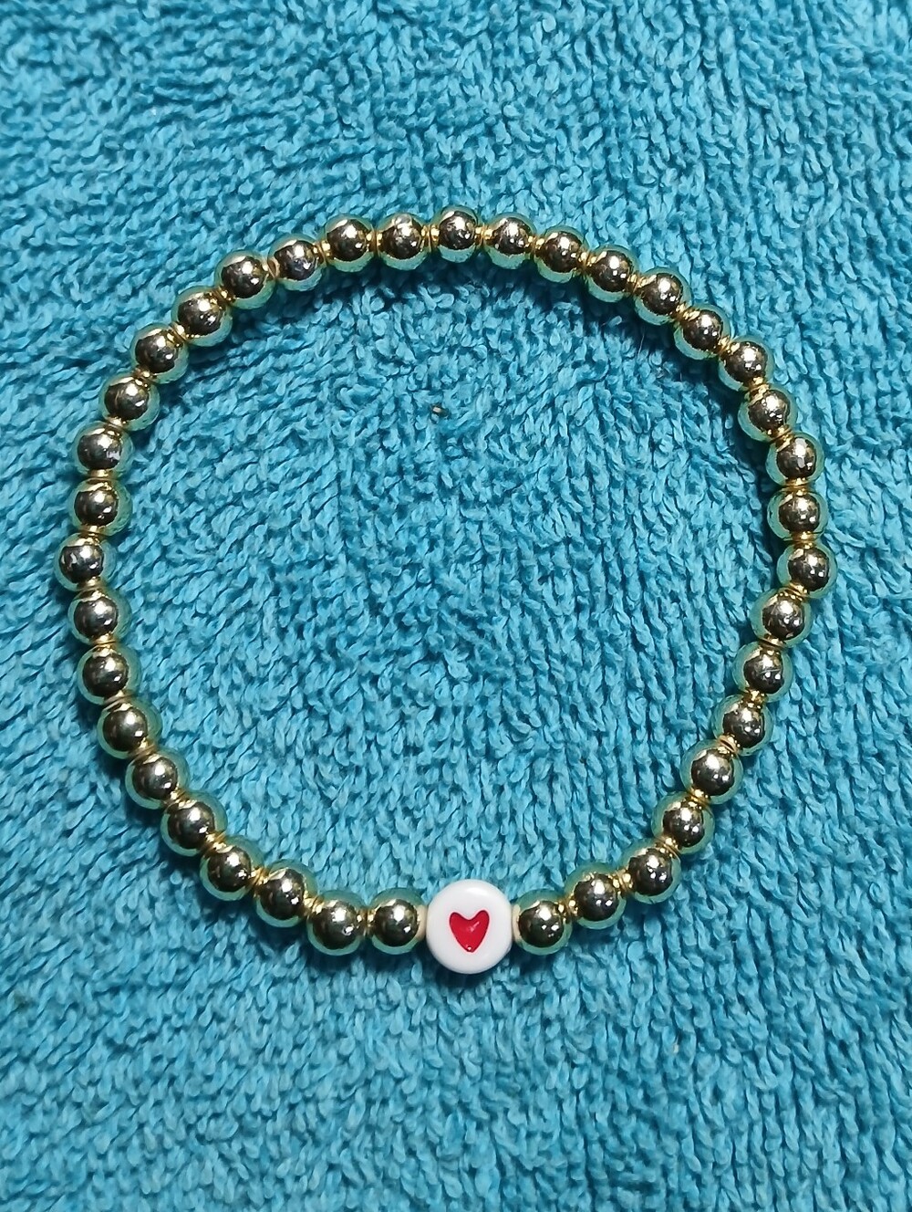 Gold Beaded Stretch Bracelet with Red Heart Accent